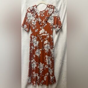 Orange floral midi dress with puff sleeves brand is velvet torch size large.